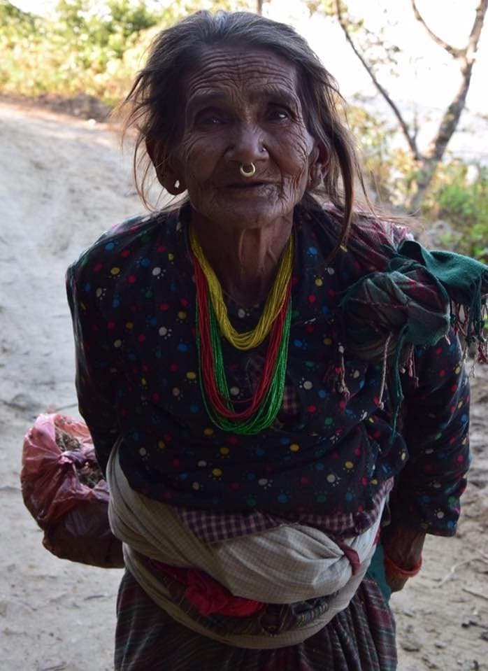Elderly local Tamang woman met on a village walk near Nagarkot, Nepal