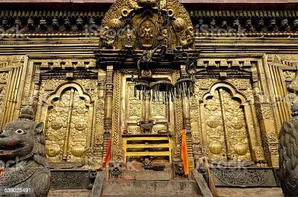 Ornate golden doorway and carved woodwork at Changu Narayan Temple